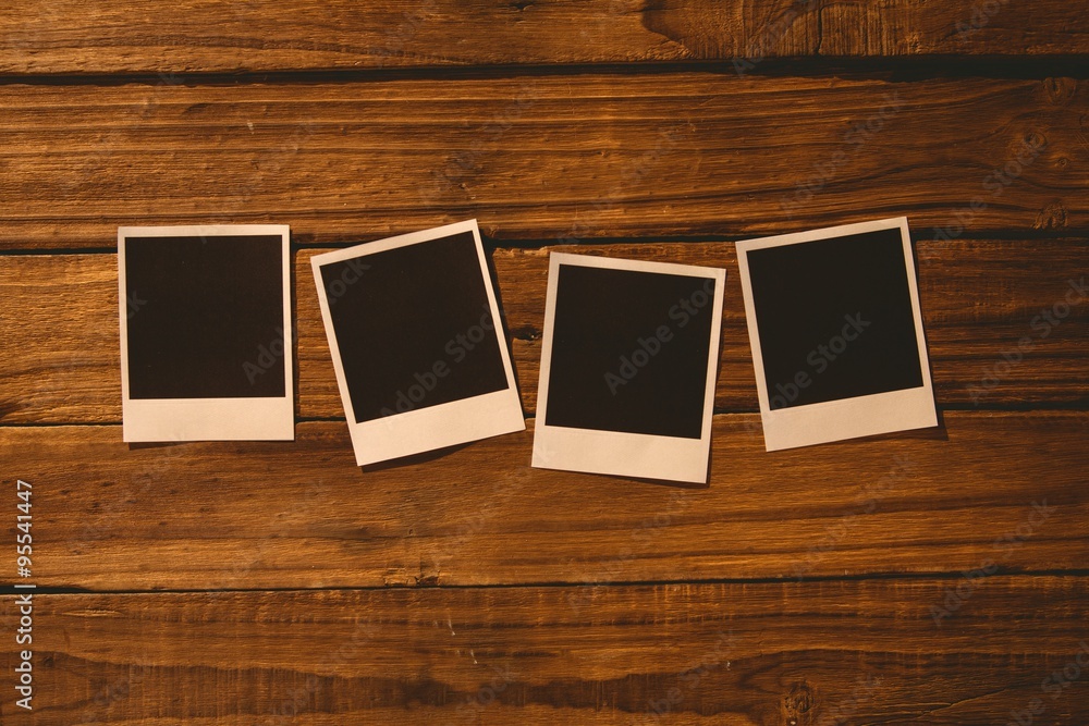 Instant photos on wooden floor