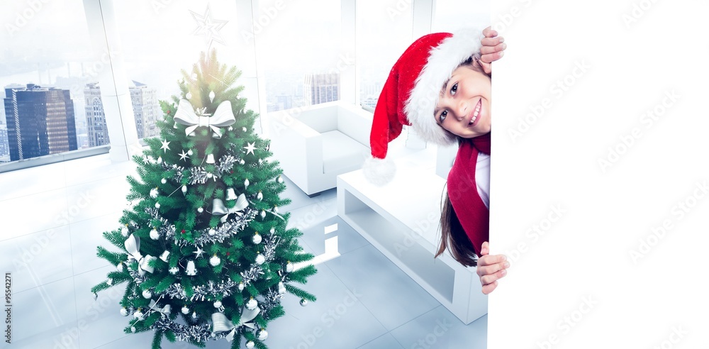 Composite image of festive little girl showing card