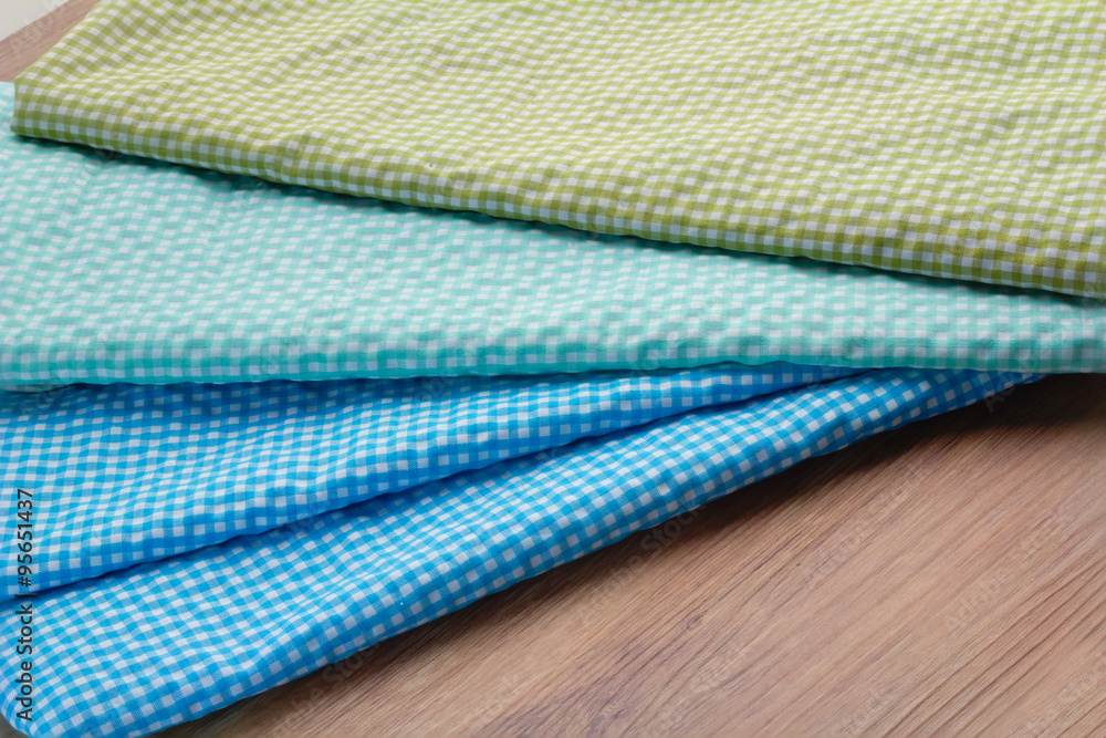 colorful checkered tablecloth on wooden table