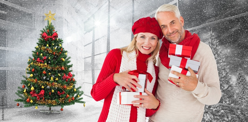 Composite image of happy festive couple with gifts