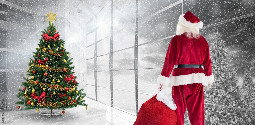 Composite image of santa carrying sack of gifts 