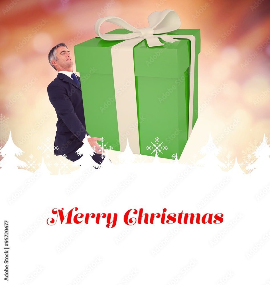 Composite image of stylish man with giant gift