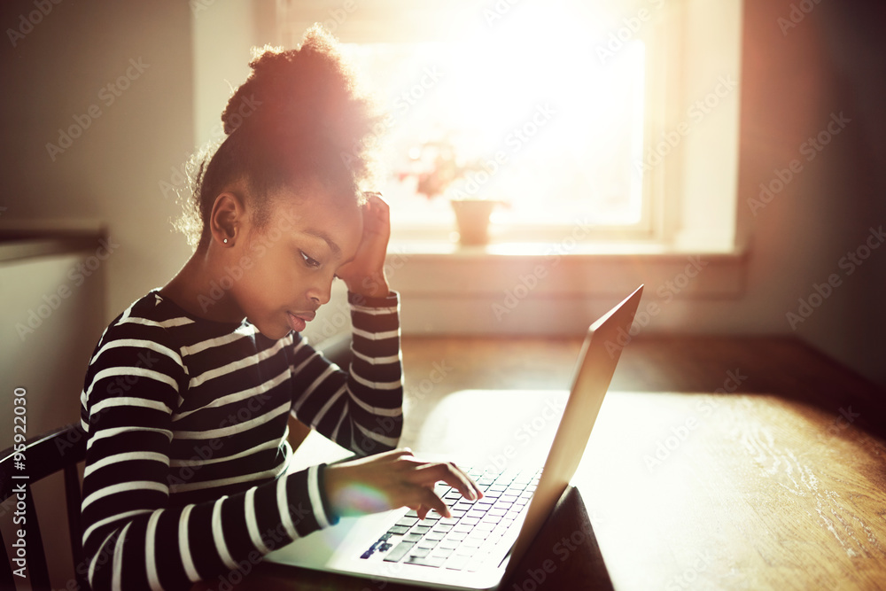 young black girl working on her homework