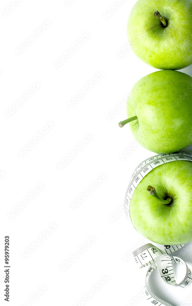 green apple with Measuring tape on white background in concept o