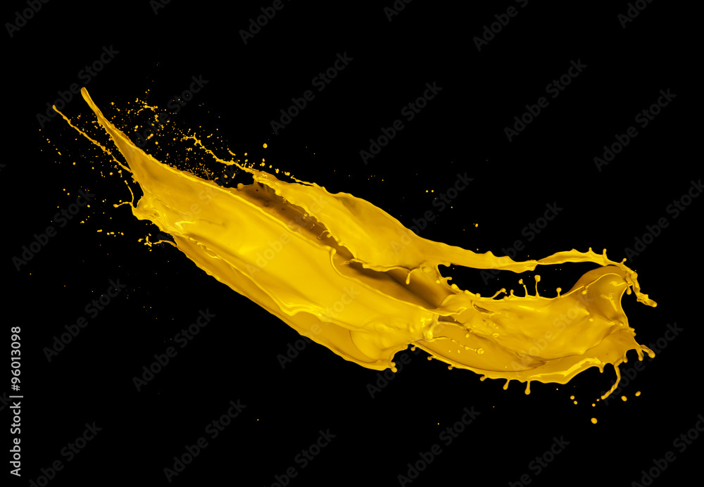 Yellow paint splash on black background