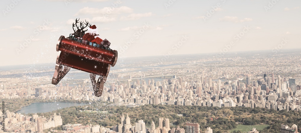 Composite image of santa flying his sleigh