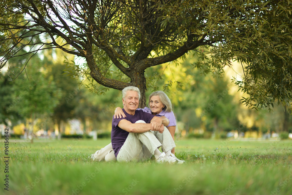 couple sitting on green