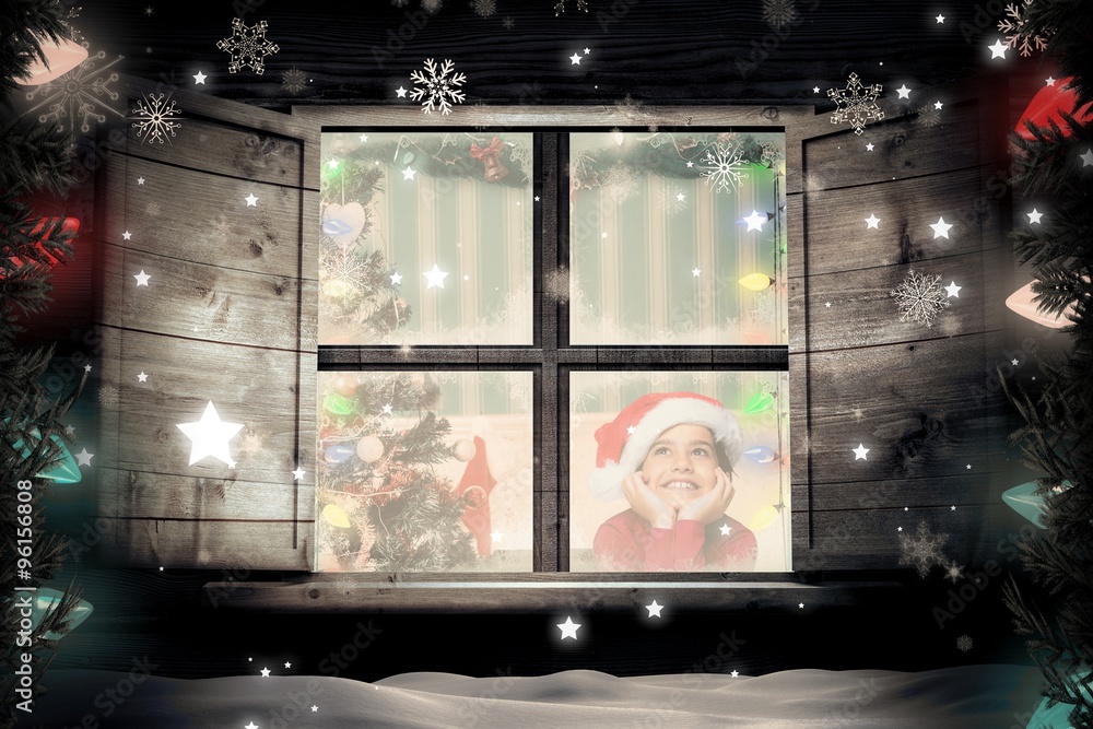 Composite image of festive little girl smiling and looking up