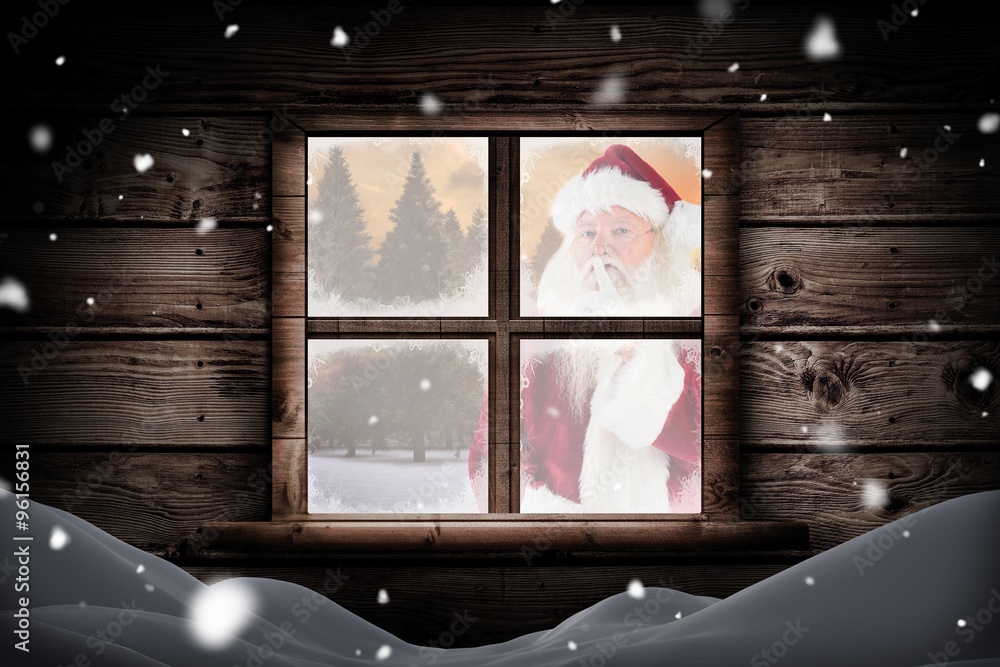 Composite image of santa asking for quiet to camera