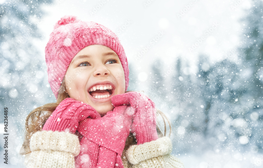 girl playing on a winter walk