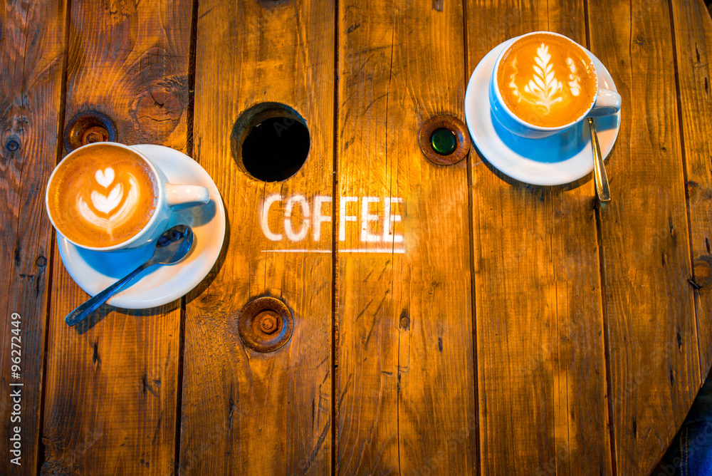 Coffee with beautiful art shape on the wooden table