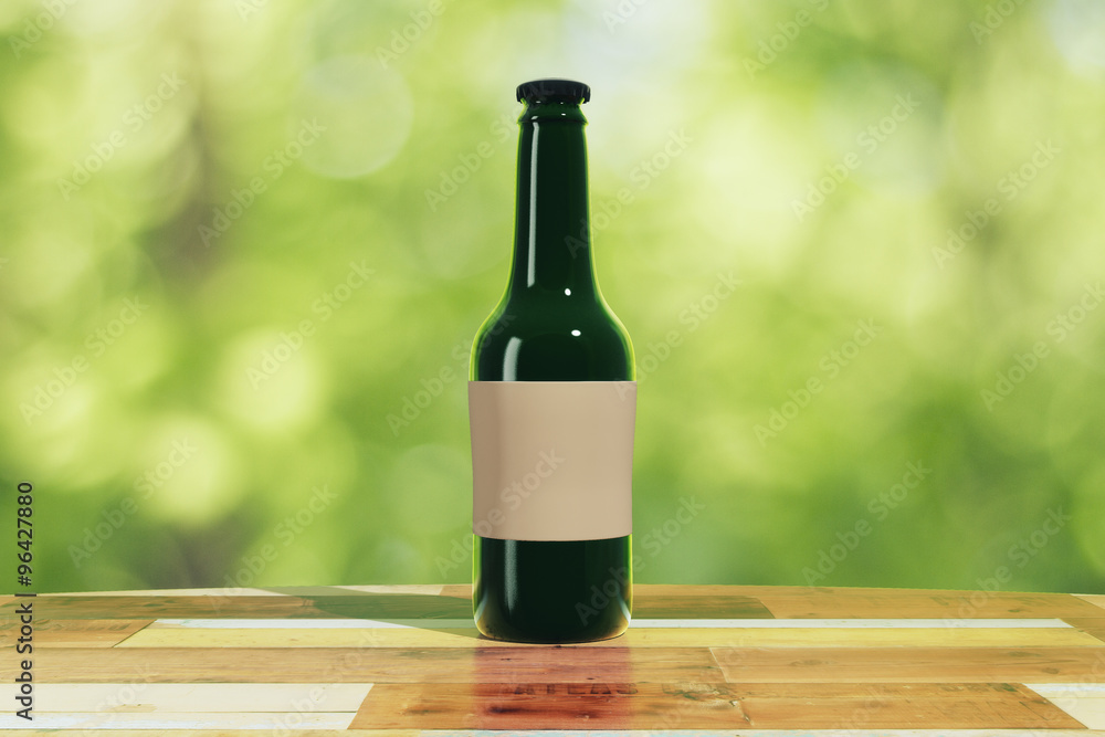 Black bottle with blank sticker on wooden table outdoor, mock up