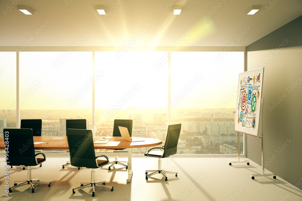 Modern conference room with blackboard at sunset