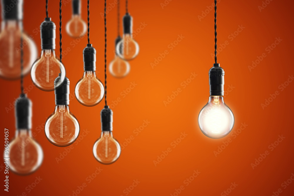 Idea and leadership concept Vintage incandescent Edison bulbs on