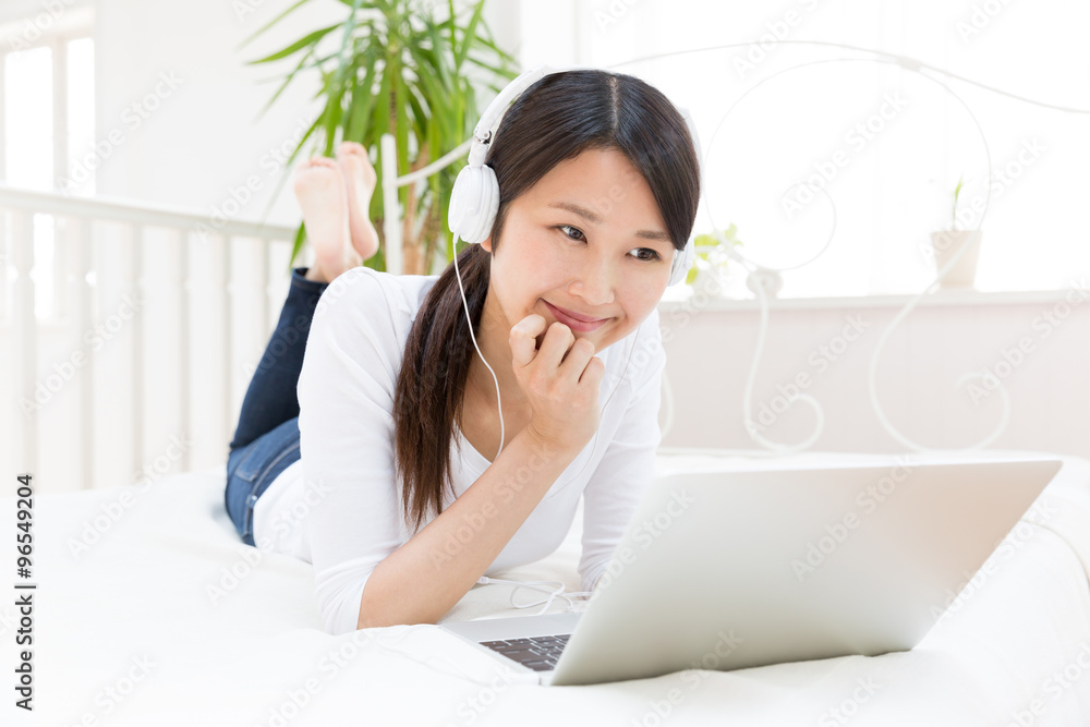 young asian woman using laptop