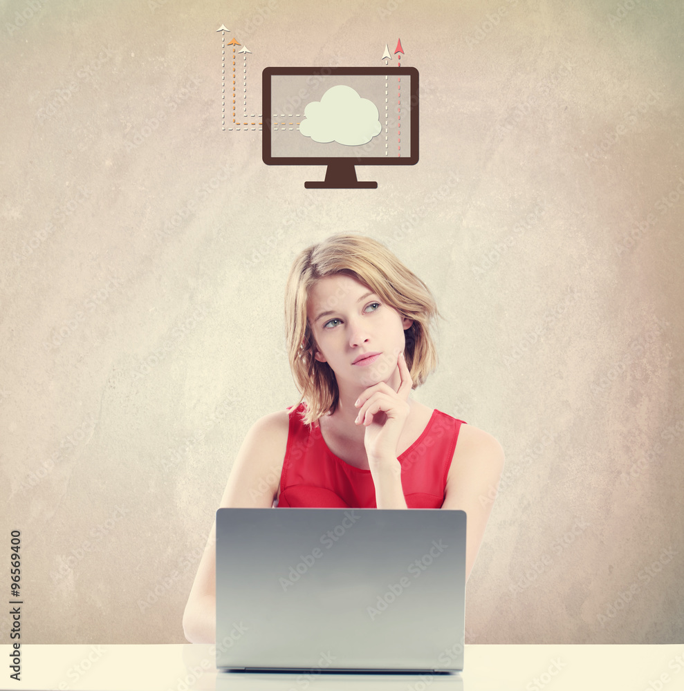  Cloud concept with woman working on a laptop