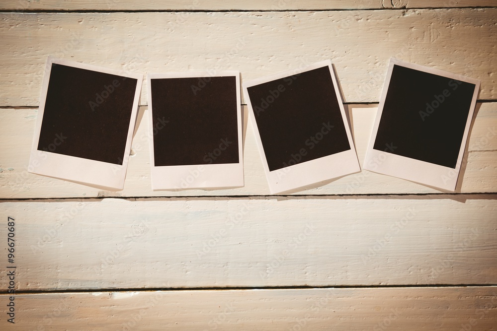 Instant photos on wooden floor