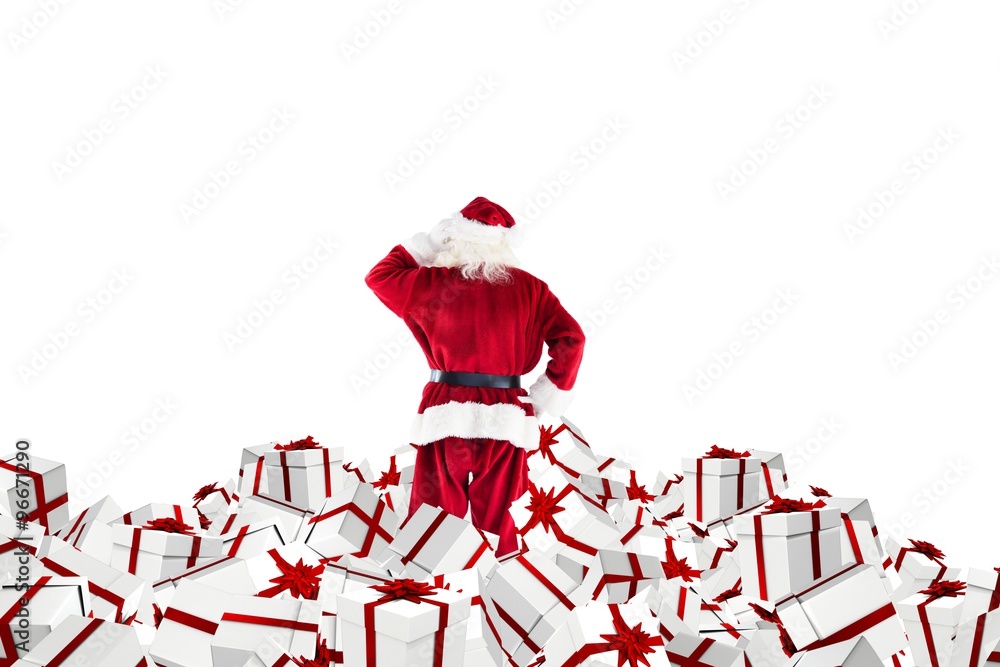 Santa standing on pile of gifts