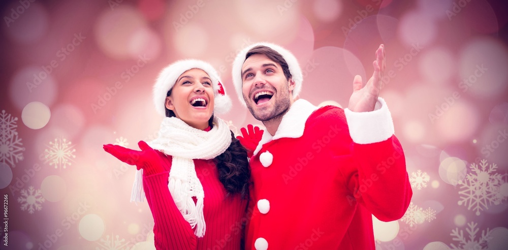 Composite image of festive young couple