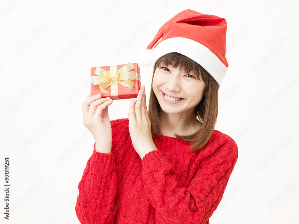 サンタ帽子をかぶる女性　クリスマスプレゼント