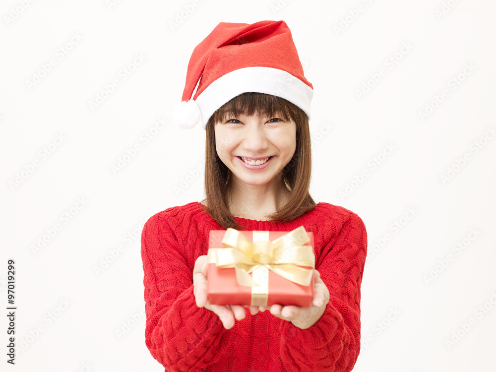 サンタ帽子をかぶる女性　クリスマスプレゼント