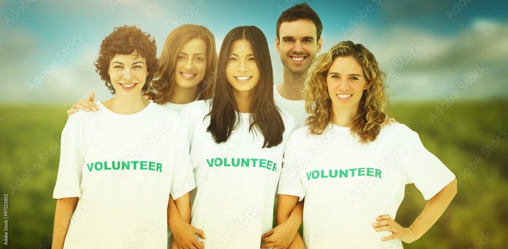 Composite image of group of people wearing volunteer tshirt