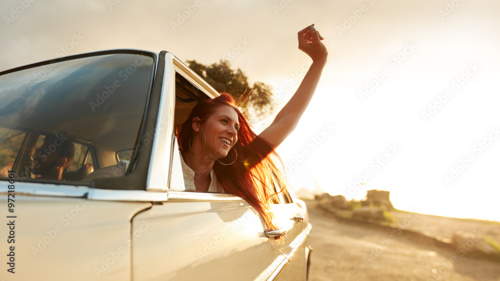 Young woman enjoying road trip