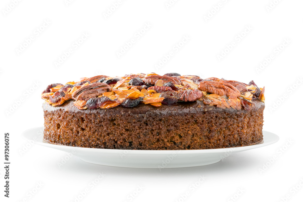 Pecan cake made with sliced almonds and dried cranberries isolated on white 