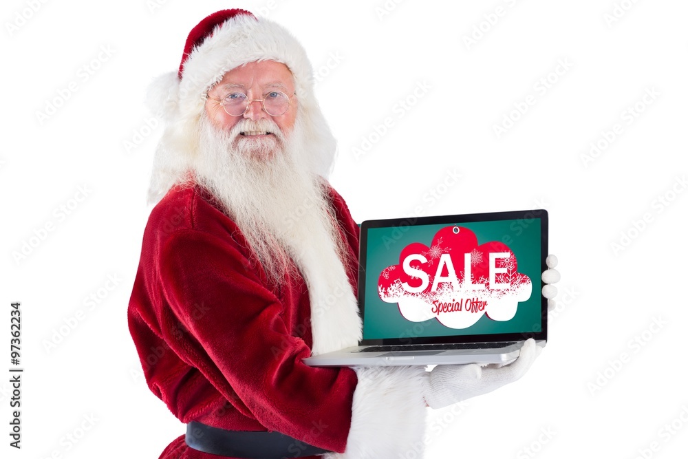 Composite image of santa claus presents a laptop