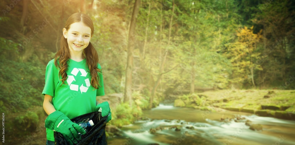 Composite image of happy little girl collecting rubbish 