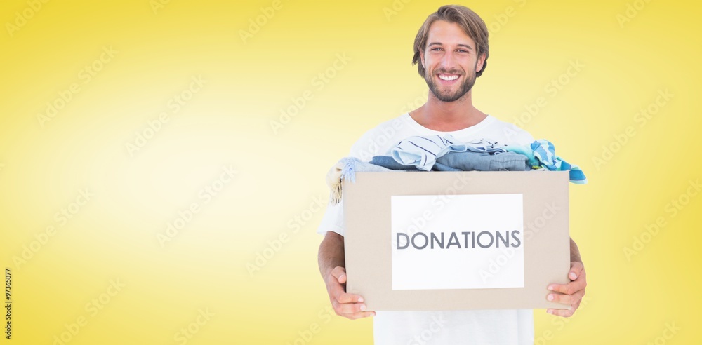 Composite image of happy man carrying donation box