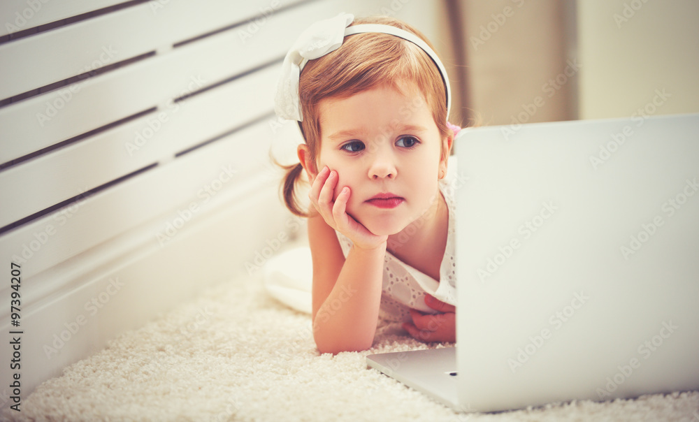 child little girl with a laptop computer