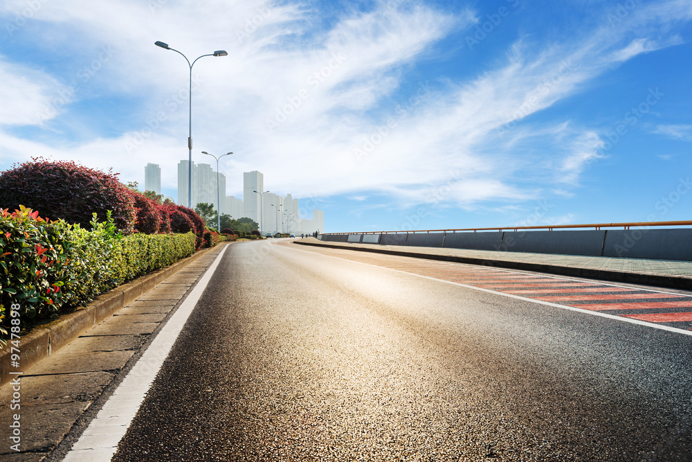 skyline and empty road to modern building