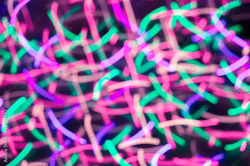 Defocused christmas lights with motion blur. New Year bokeh