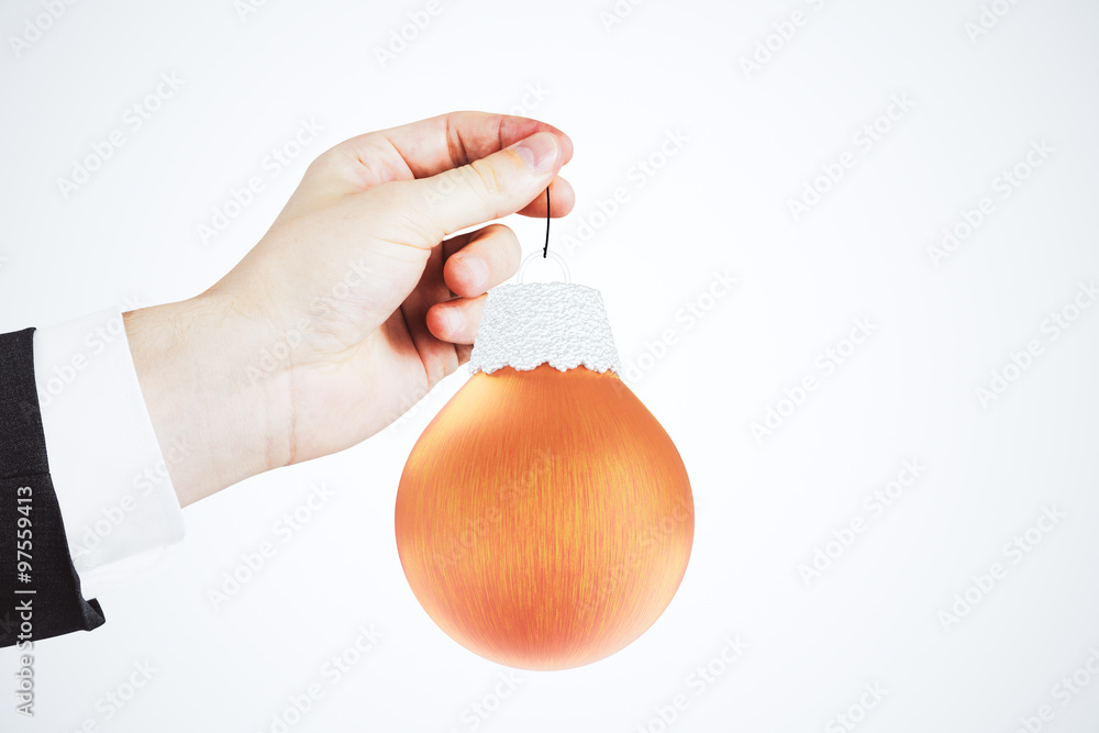 Businessman with christmas tree red ball