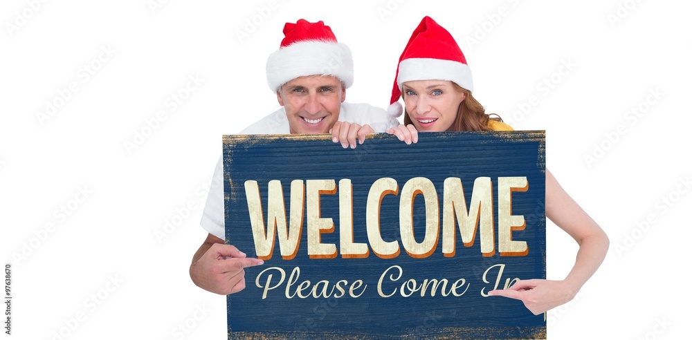 Composite image of festive couple showing a poster