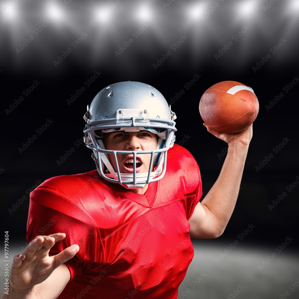 Portrait of american football player throwing ball