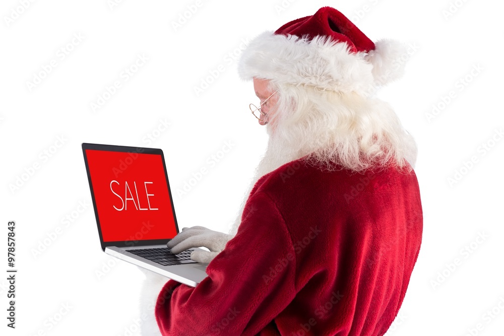 Composite image of santa claus uses a laptop