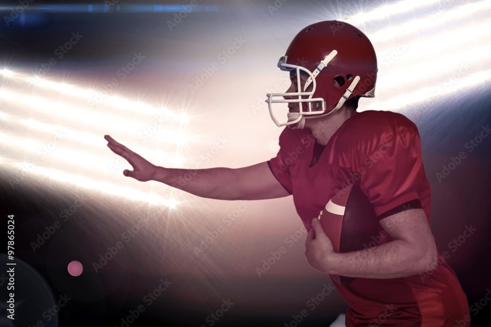 American football player running with the ball