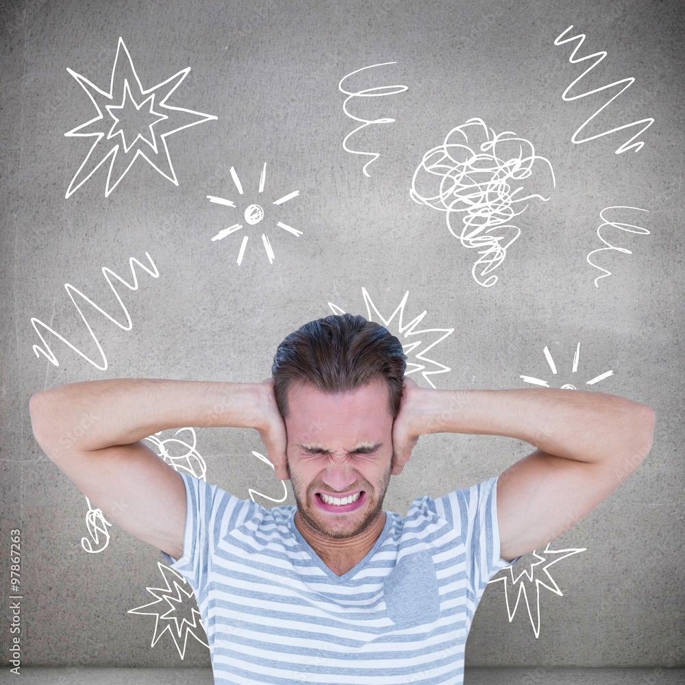 Man screaming with hands on ears