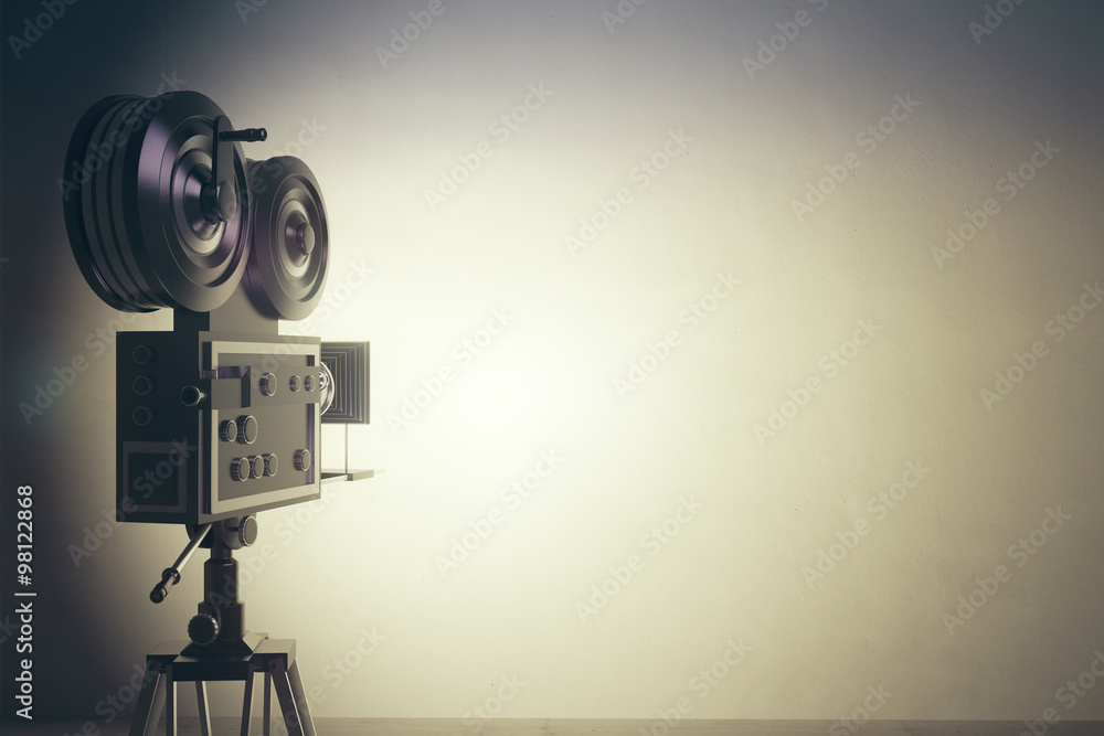 Old style movie camera with white wall, vintage photo effect