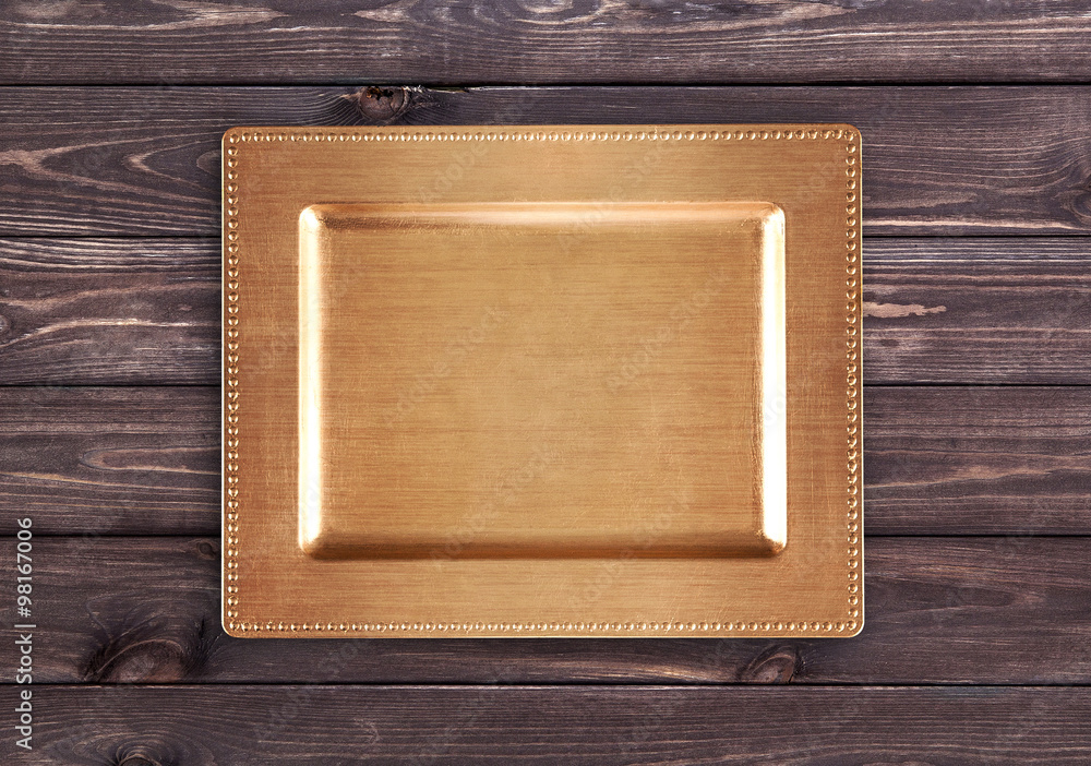 Vintage golden tray on wooden table