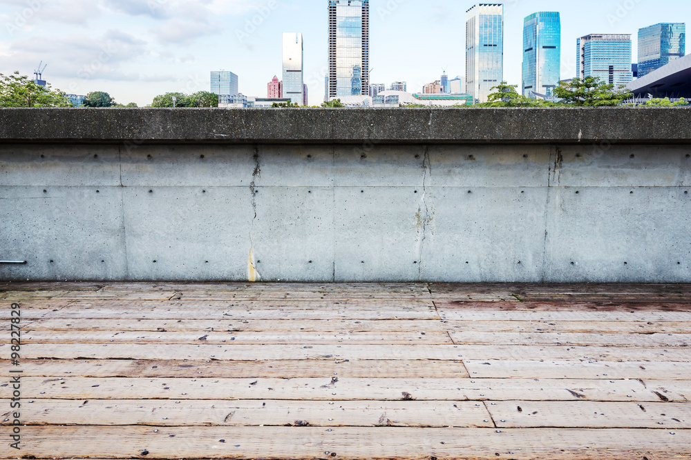 skyline and cityscape on view of empty wooden floor