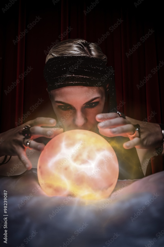 Composite image of fortune teller forecasting the future