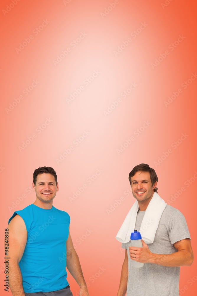 Fit men with water bottle and towel