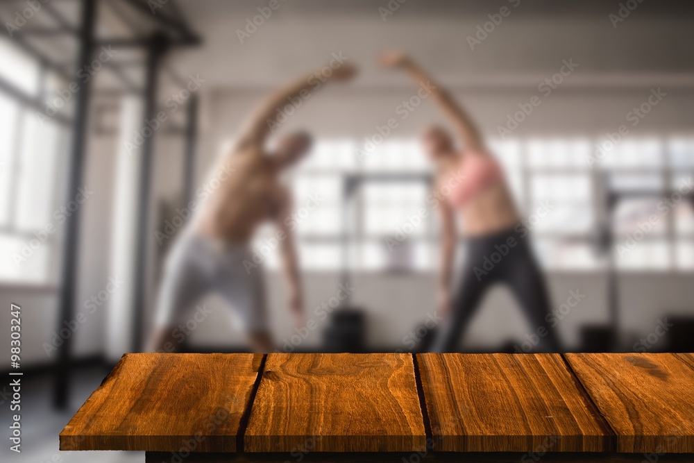 Composite image of two fit people doing fitness