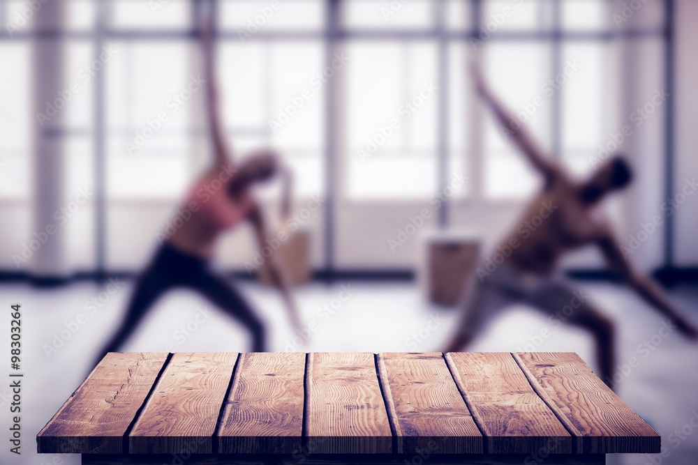 Composite image of two fit people doing fitness