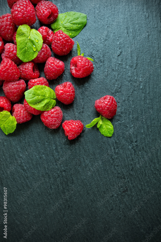 Heap of raspberry on stone