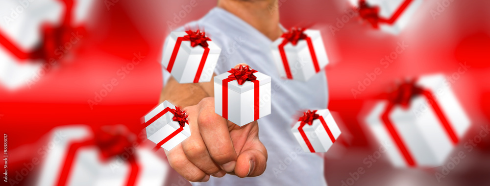 Man celebrating christmas holding gift in his hand