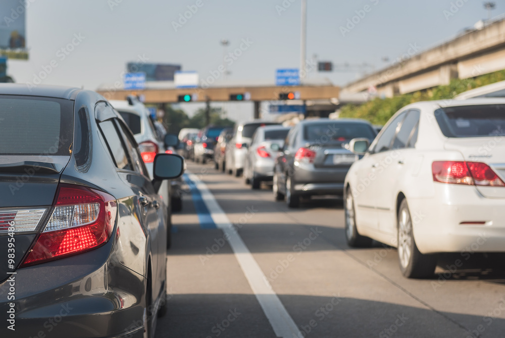 car queue in front of express way gate